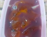 A picture of step 4 of Pista fruit custard orange jelly with black currant sauce.