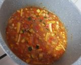 A picture of step 5 of Burnt chilli garlic rice with baked beans gravy.