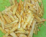 A picture of step 1 of Chips masala, wetfry beef with sausages.