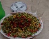 A picture of step 16 of Rainbow Macroni Party Platter.