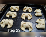 A picture of step 23 of Bow tie buns.