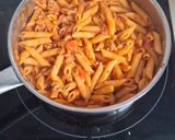 A picture of step 5 of Creamy Tomato Penne with Pork and Basil.