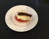 A picture of step 7 of Turkey and Ham Club Stuffed Tomato.