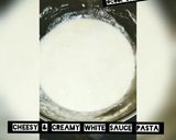 A picture of step 2 of Cheesy & creamy white sauce pasta🍜.
