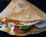 A picture of step 8 of Tortilla Wrap with egg and veggies.