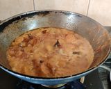 A picture of step 10 of Onion Tomato Chicken.