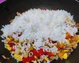 A picture of step 5 of Thai style fried rice with vegetables and tofu.