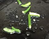A picture of step 2 of Bhindi Posto.