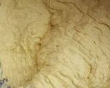 A picture of step 5 of Lemon cake with rough butter iced.