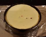 A picture of step 13 of White Chocolate Cherry Truffle Cheesecake.
