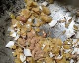 A picture of step 1 of Bihur guror nariyal pitha.