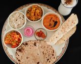 A picture of step 8 of NORTH INDIAN THALI For lunch mutter -paneer, aloo gobhi, moong dal tadka,jeera rice,pickle, roti.