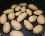 A picture of step 1 of Garlic and parsley butter sautèed new potatoes 🎄.