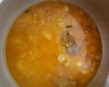 A picture of step 6 of Onion turmeric pulao wrapped in egg.