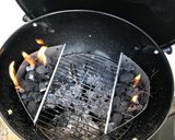 A picture of step 1 of Beer can chicken on the Braai (BBQ) with coal charred corn on the cob.