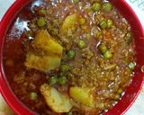 A picture of step 3 of Mutton mince with potato green peas.
