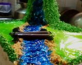 A picture of step 13 of Blackforest jungle theme cake.