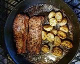 A picture of step 3 of Sirloin Steaks with fried baby potatoes & a greek salad.