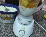 A picture of step 1 of Pineapple and mango smoothie, with ice cream.