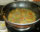 A picture of step 1 of Beans Tomato Egg drop soup.