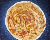 A picture of step 3 of Thin crust chicken shrimp pizza (stovetop).