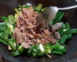 A picture of step 6 of Stir-fried Beef with Spring Onion.