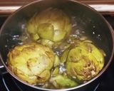 A picture of step 1 of Grilled Artichokes with Garlic, Oil, and Parsley Dressing.