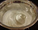 A picture of step 10 of Patriotic Vanilla Cake Roll with Whipped White Chocolate Ganache Filling and Frosting.