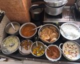 A picture of step 1 of Shreekhand with dryfruits and Pooris.