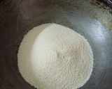 A picture of step 1 of Rava besan dry fruit laddu.