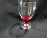 A picture of step 1 of Devil's Knight Layered Mocktail.