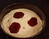 A picture of step 7 of White Layer Cake with a Raspberry Swirl Cheesecake center layer and a Raspberry Cream Frosting.
