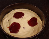 A picture of step 7 of White Layer Cake with a Raspberry Swirl Cheesecake center layer and a Raspberry Cream Frosting.