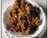A picture of step 10 of Dahi chicken.