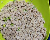A picture of step 2 of Soya granules with potato and fresh green peas.