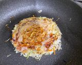 A picture of step 5 of Omu-Okonomiyaki (Japanese as-you-like pancake wrapped with egg).