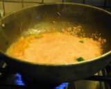 A picture of step 4 of Pasta sizzler sizzling with hot chilli powder, veggies, cheese.