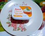A picture of step 2 of Amul cheese spread vegetable sandwich.