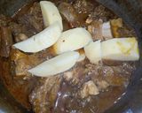 A picture of step 9 of Aloo Gosht.