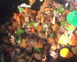 A picture of step 3 of Stir fried Potato, vege & meat.