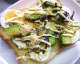 A picture of step 4 of Boiled Egg and Avocado Toast with Wasabi, Shiso, and Salted Kelp.