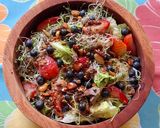 A picture of step 2 of Green Salad with Strawberries, Blueberries, and Savory Granola.