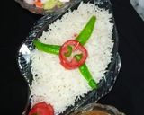 A picture of step 4 of Khatte Masar with boiled rice 🍽.