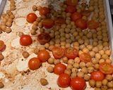 A picture of step 4 of Halloumi with pesto, balsamic tomatoes, spinach and chickpeas.