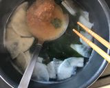 A picture of step 2 of Japanese radish and seaweed miso soup.