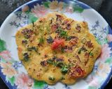 A picture of step 8 of Besan onion tomato chilla.