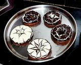 A picture of step 8 of Spider-web Glazed Donuts 🍩.