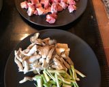 A picture of step 2 of Paella with Secreto Pork, Mushrooms, and Green Garlic.