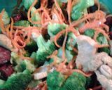 A picture of step 9 of Buttery broccoli salad topped with deviled eggs.