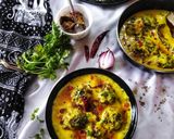 A picture of step 13 of Punjabi kadhi with baked pakoras.